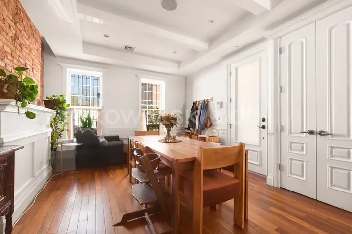 Living / dining room, looking toward the entry and front windows